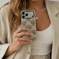 Art Nouveau Sage Floral matte case on iPhone 17 Pro Max, styled with vintage sketches and natural light on a rustic wooden table.