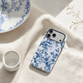 Blue Chinoiserie Floral matte case on iPhone 17 Pro Max, styled with minimalist tea sets and soft shadows for a refined East-meets-West aesthetic.