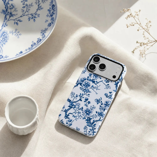 Blue Chinoiserie Floral matte case on iPhone 17 Pro Max, styled with minimalist tea sets and soft shadows for a refined East-meets-West aesthetic.