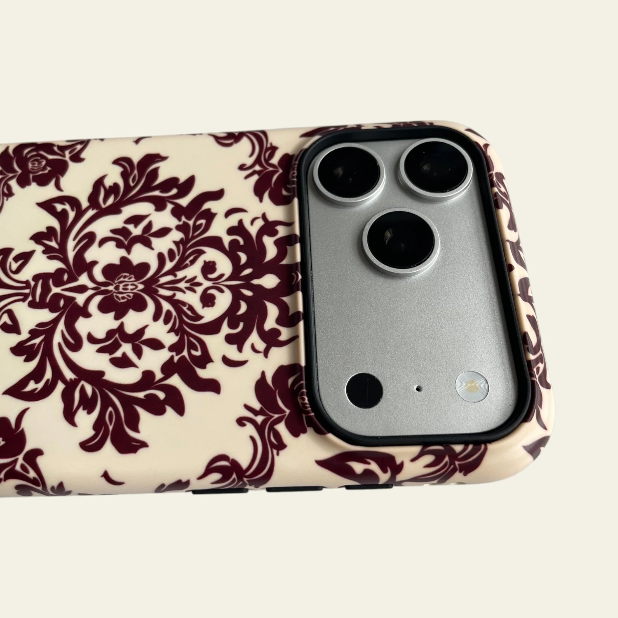 Detailed view of the raised black camera bezel on the iPhone 17 Pro Max case, providing professional lens protection with a sleek profile.