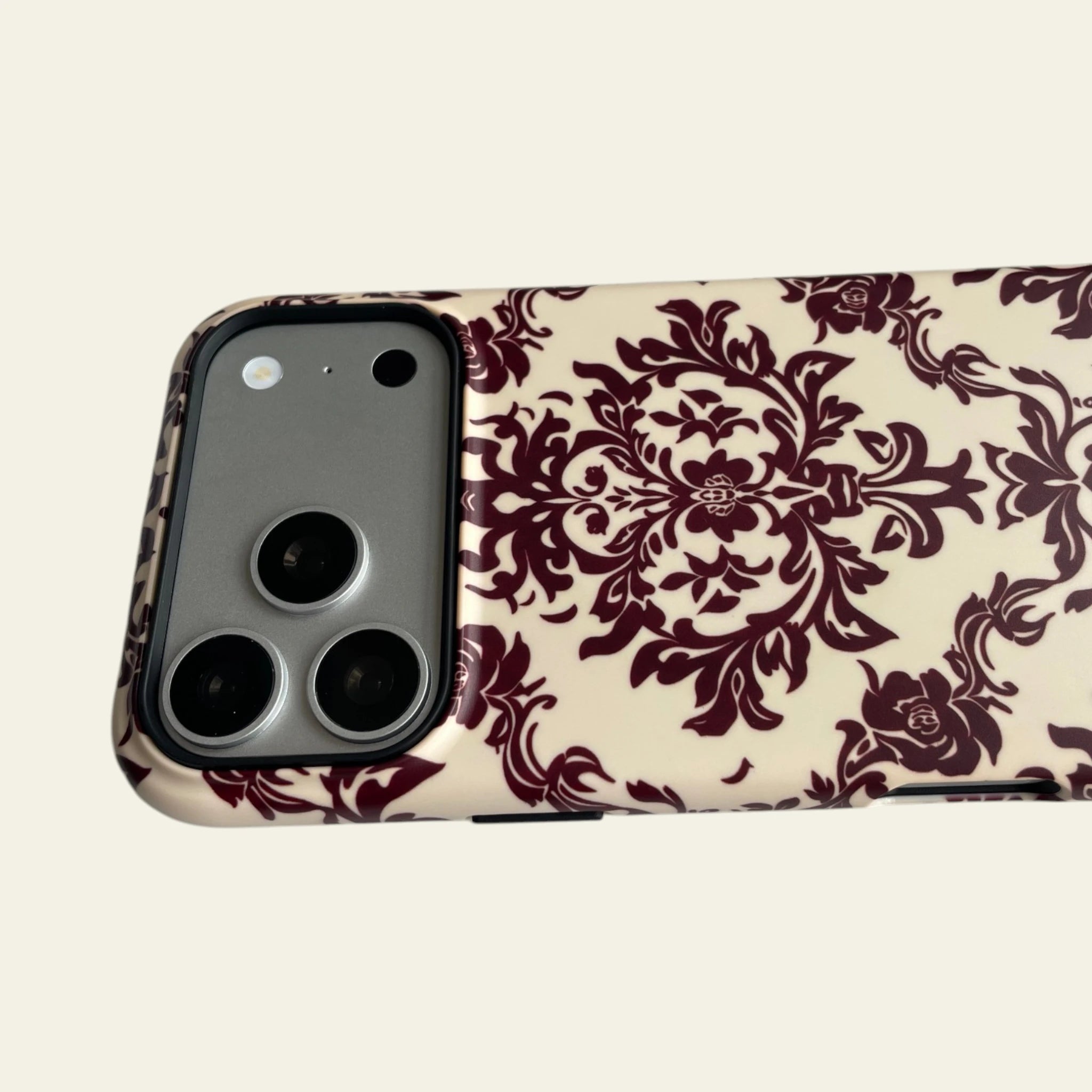 Close-up of the premium matte finish on the Burgundy Damask case, highlighting the anti-fingerprint and not easy to fade surface.
