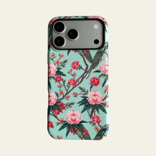 Front view of Mewvia Chinoiserie Peacock & Peony case for iPhone 17 Pro Max, showcasing the intricate botanical art and matte finish.