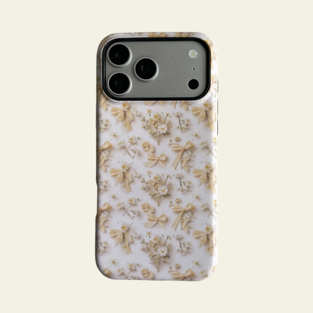 Front view of Mewvia Coquette Bow & Daisy case for iPhone 17 Pro Max, showcasing the intricate floral and ribbon patterns with MagSafe compatibility.