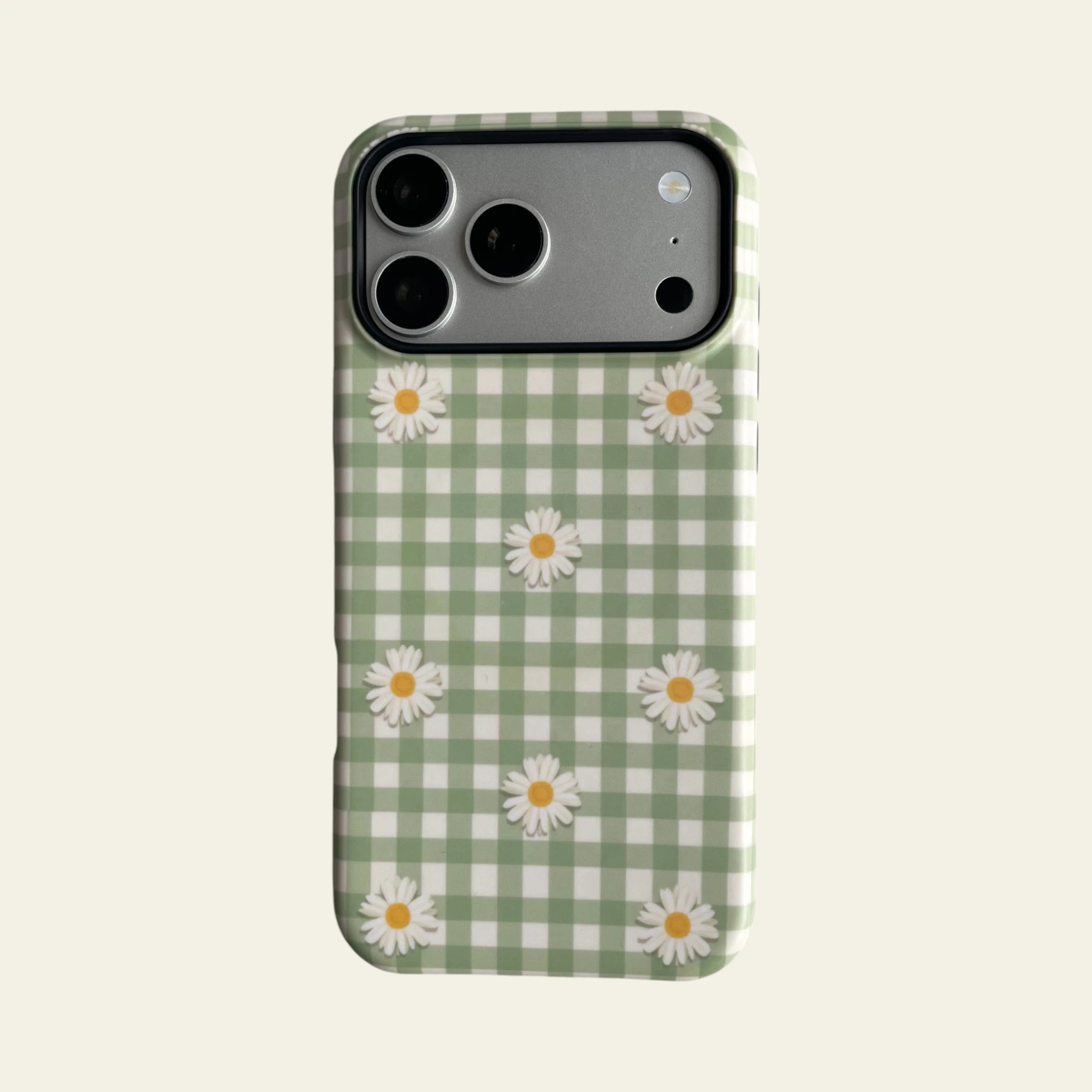 Front view of Mewvia Mint Gingham Daisy case for iPhone 17 Pro Max, showcasing the elegant checkered pattern and hand-drawn daisy illustrations.
