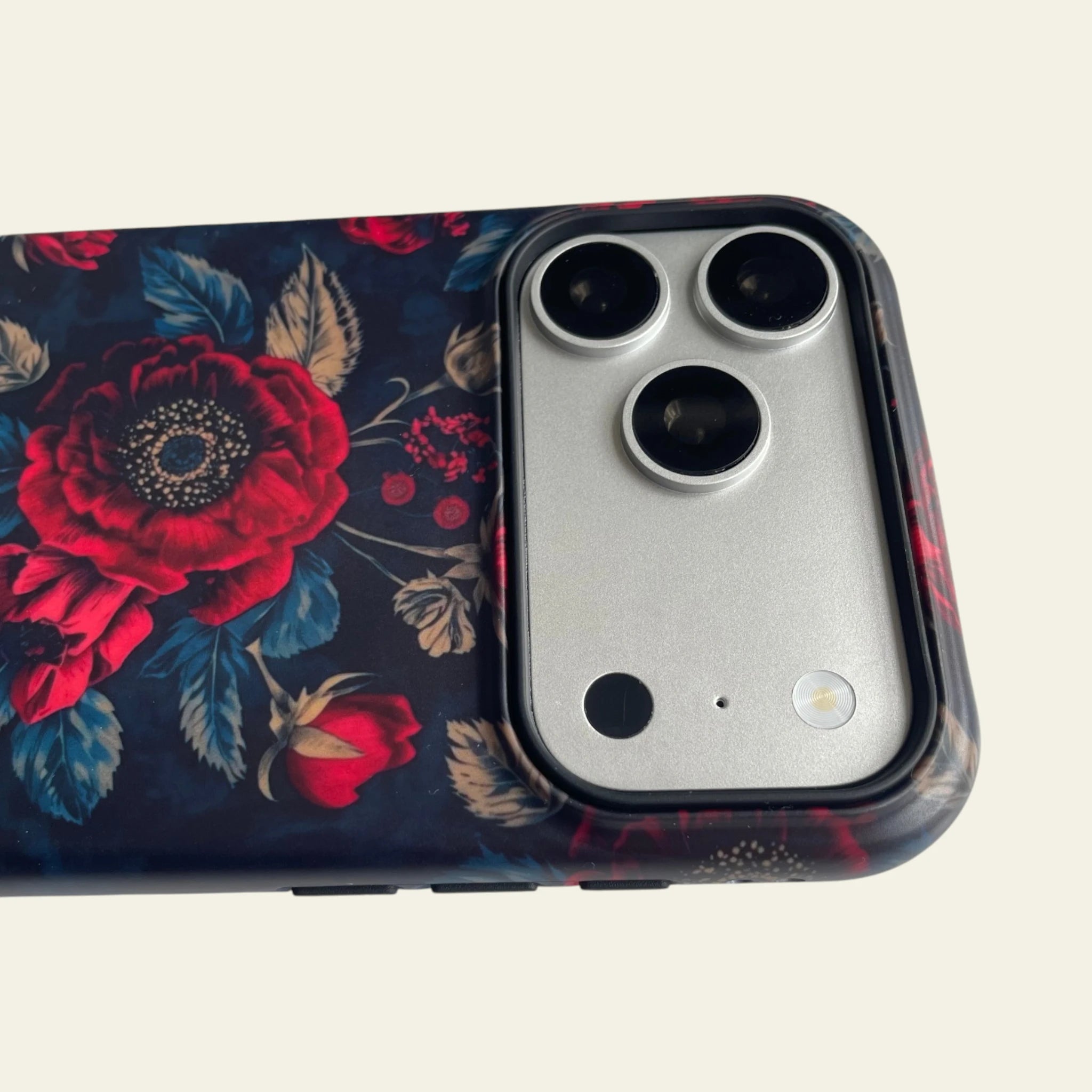 Close-up detail of the matte texture on Mewvia Moody Dark Botanical iPhone 17 Pro Max case.