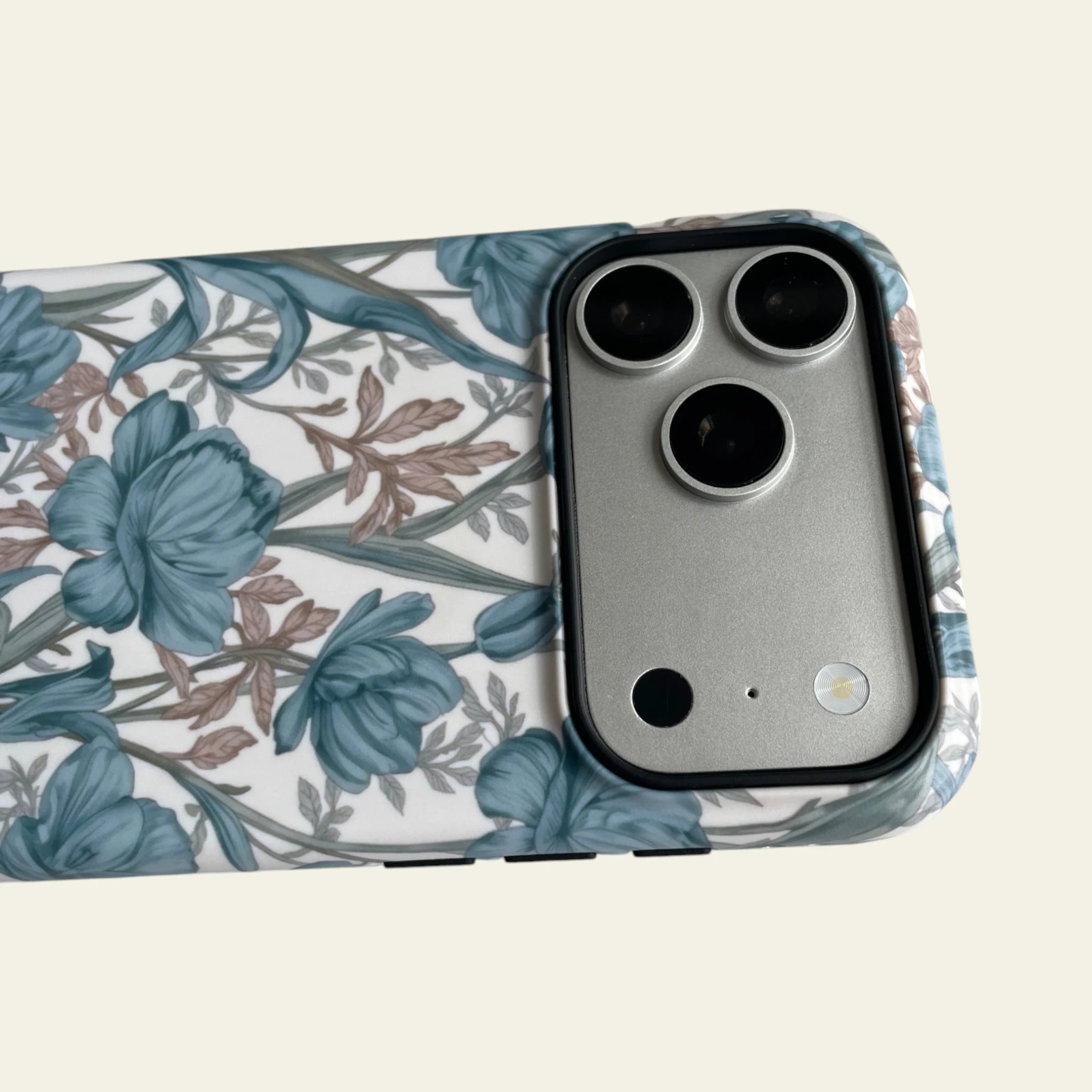 Detailed shot of the raised black camera bezel on the iPhone 17 Pro Max case, providing superior lens protection.