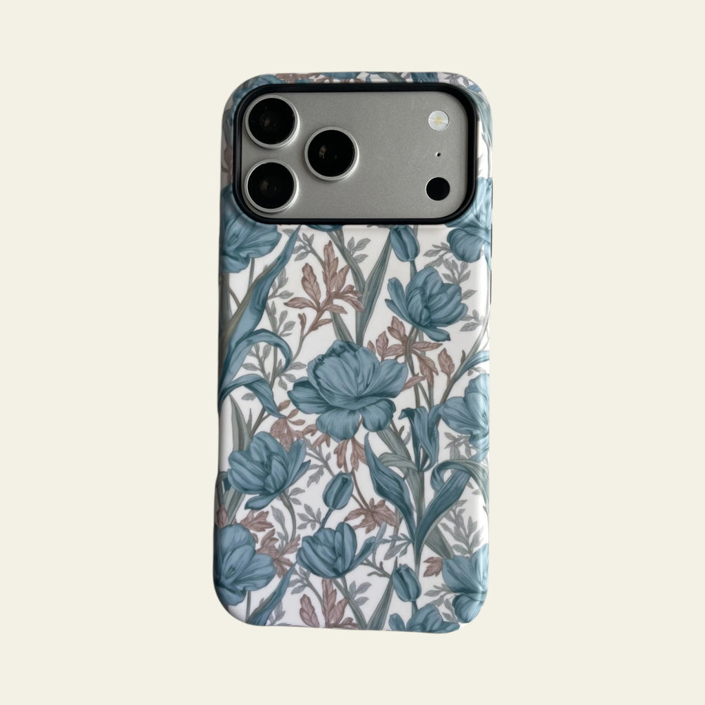 Front view of Mewvia Blue Tulip Floral case for iPhone 17 Pro Max, featuring hand-drawn botanical patterns on a clean background.