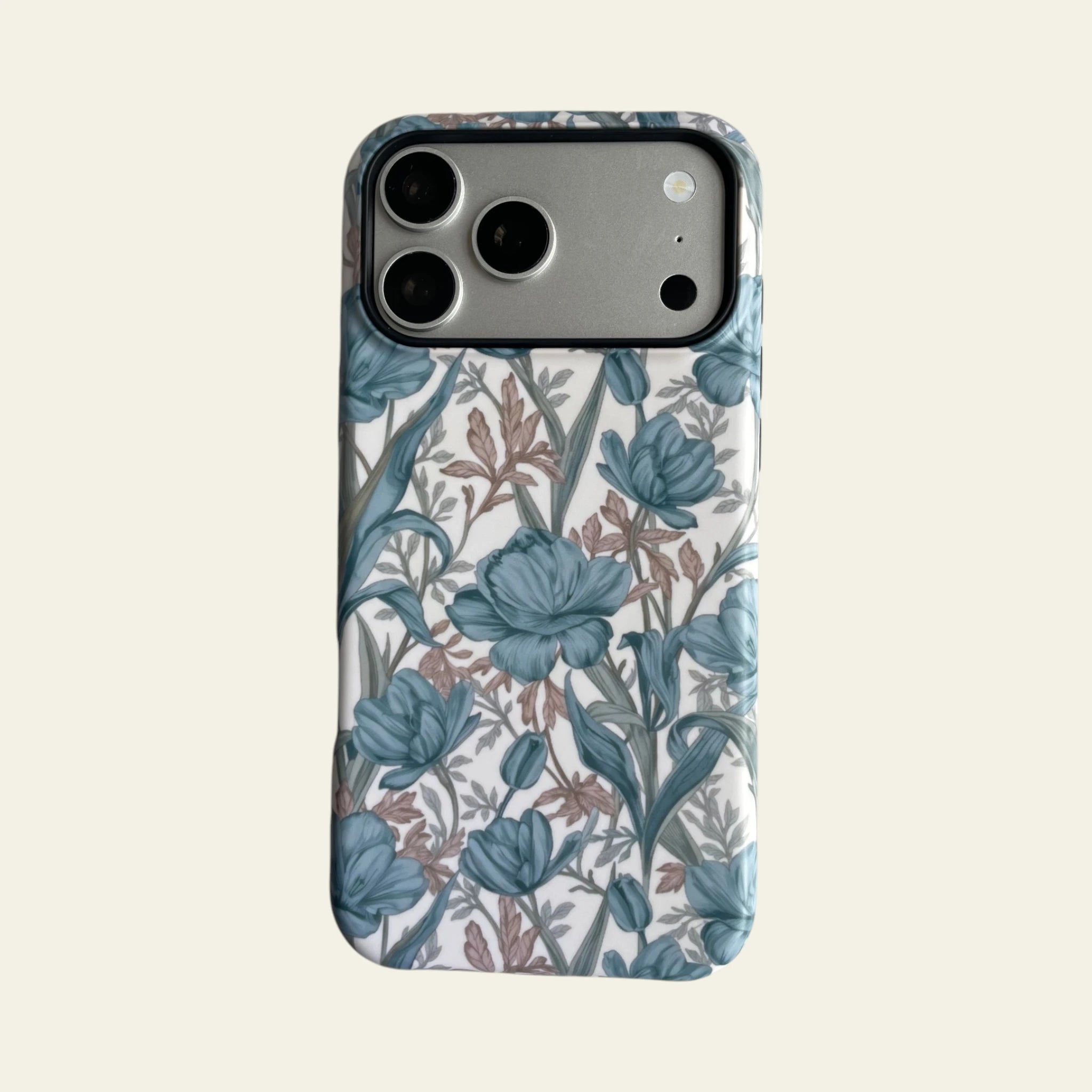 Front view of Mewvia Blue Tulip Floral case for iPhone 17 Pro Max, featuring hand-drawn botanical patterns on a clean background.