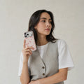 Watercolor Blush Orchid matte case on iPhone 17 Pro Max, styled with silk ribbons and soft natural light in a minimalist setting.